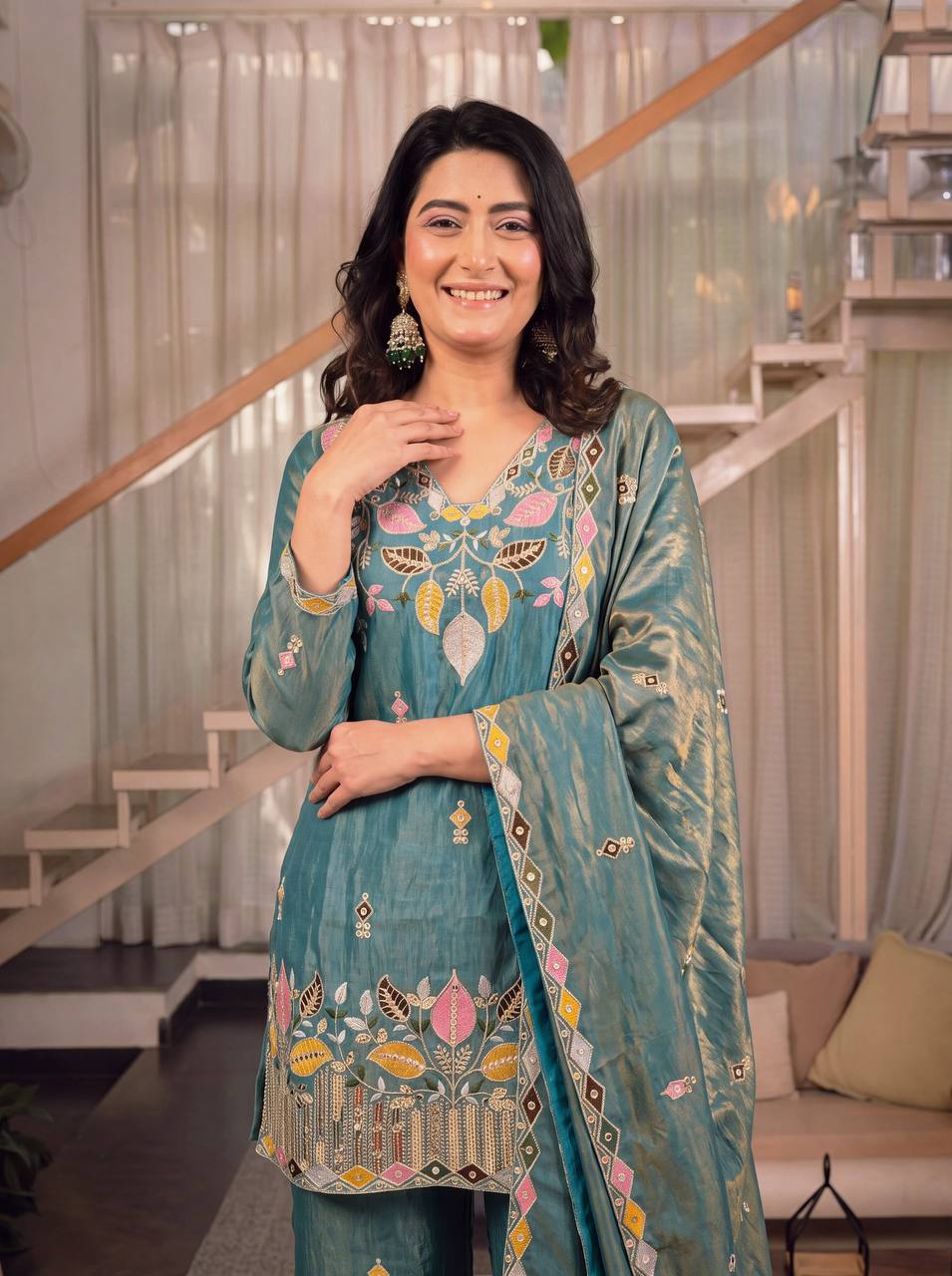 Elegant Rust Orange Silk Kurta and Flared Palazzo Set Adorned with Intricate Multicolored Botanical Embroidery and Mirror Work
